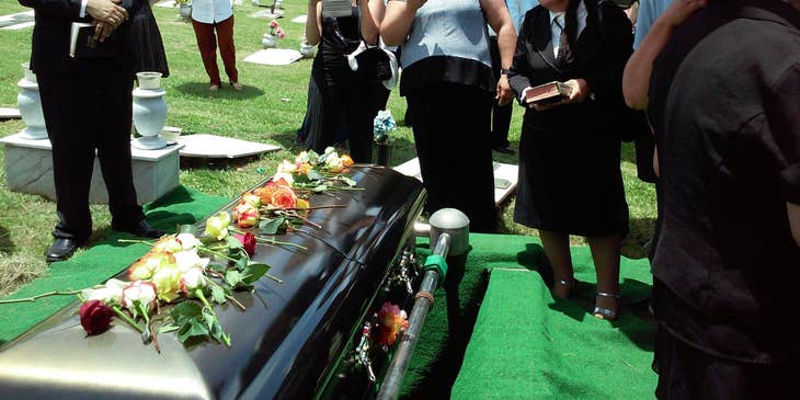 An undertaker handling funeral arrangements for the family of a deceased person.
