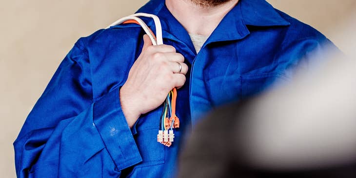 a variable frequency drive field technician wearing his safety gear