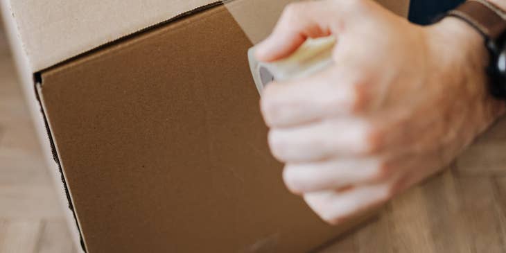 Warehouse clerk packing the item before shipment