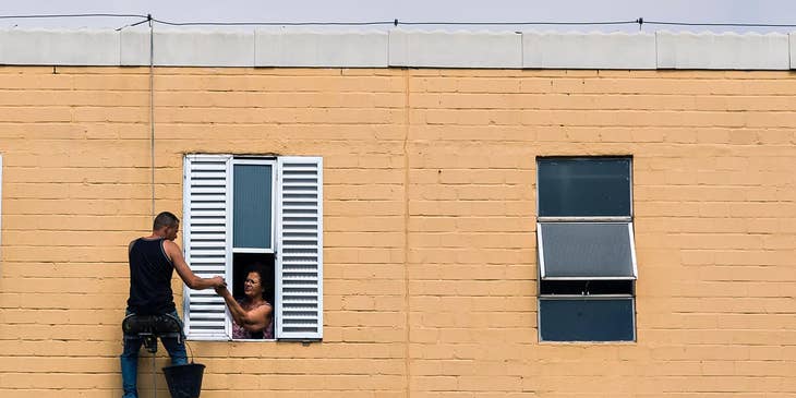 Window treatment installer fitting new shutters